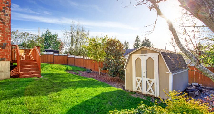 Fenced backyard with storage shed in Miami